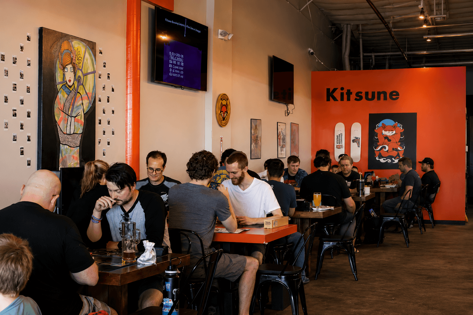 Guests gathering inside the Kitsune Brewing Co. taproom